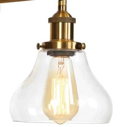 Vintage-style retro brass and glass wall sconce with clear shade and exposed filament bulb for decorbites gold led wall light