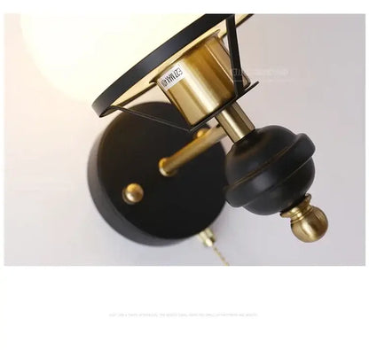 Vintage-style decorbites french wall lamp with black matte finish brass accents and oval frosted glass shade for bedroom lighting