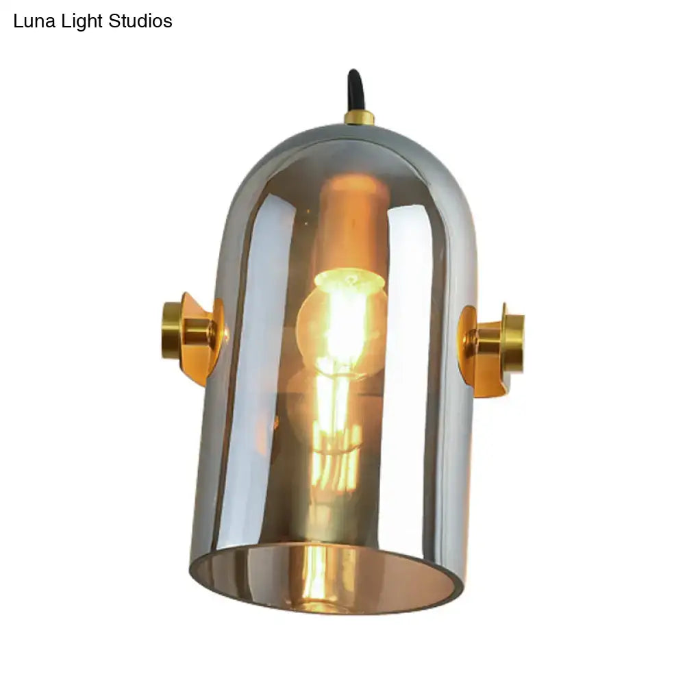 Chrome finished cloche sconce light with brass accents and clear glass dome for bedroom with retro blue glass design