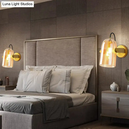 Gold-toned retro brass cloche sconce light with amber glass shades for bedroom featuring elegant cloche sconce light design