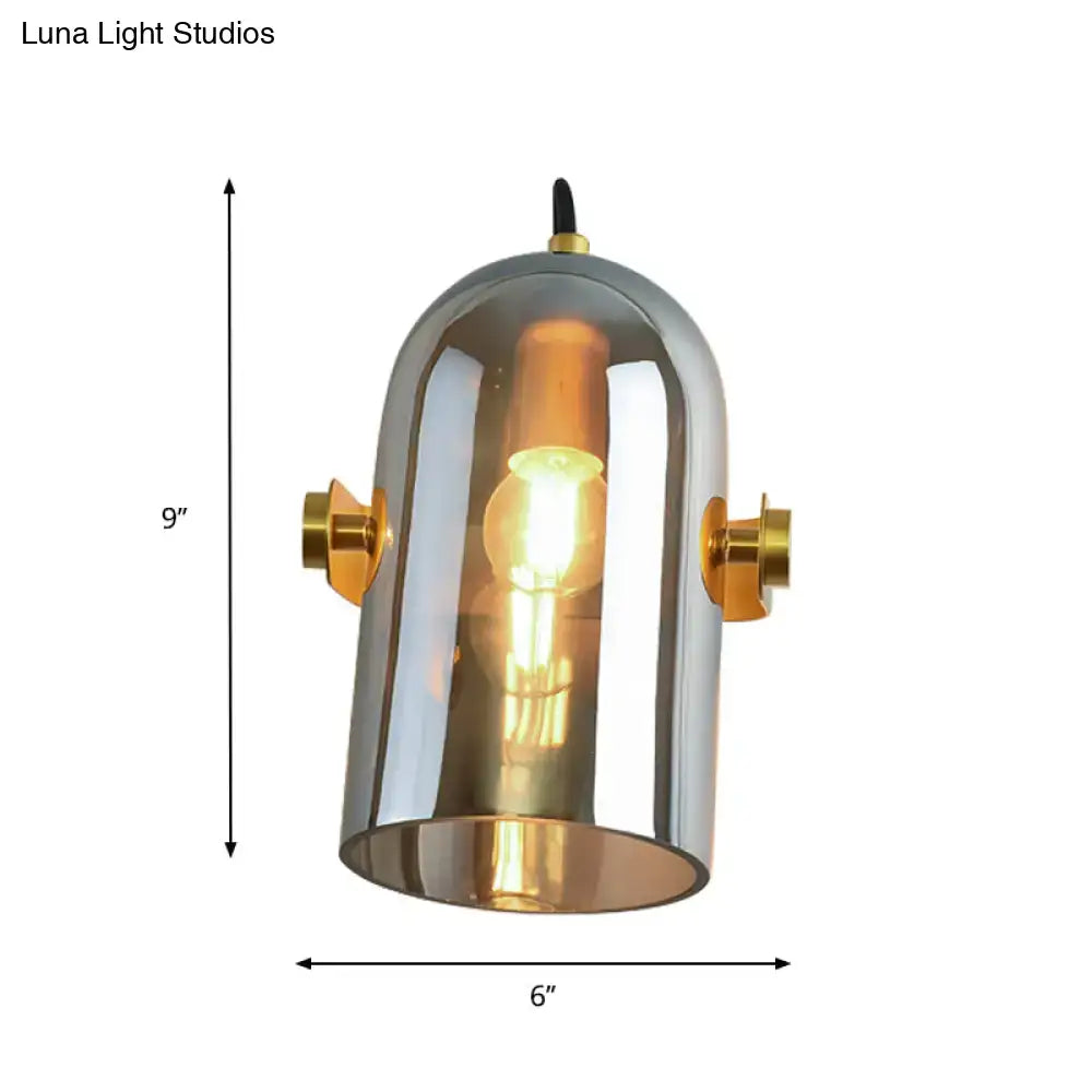 Retro brass cloche sconce light with polished chrome dome, gold-toned brass accents, and exposed filament bulb for bedroom