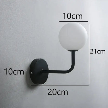 Black metal wall lamp with frosted white glass ball shade inspired by decorbites glass ball design for stylish lighting