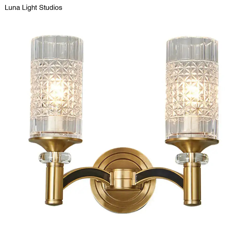 Brass-finished retro wall light with two crystal-cut glass shades and black trim for living room sconce lighting