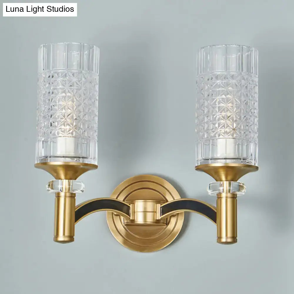 Gold-toned retro brass gridded crystal wall light with faceted shades and black trim for living room sconce lighting