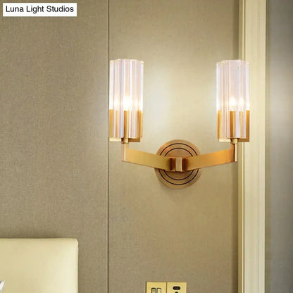 Retro brass ribbed glass wall lamp with gold-toned finish and two vertical translucent shades, inches wide wall lamp