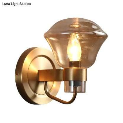 Retro brass smoke gray amber glass wall light fixture with brass finish and warm amber glass shade for bedroom sconce