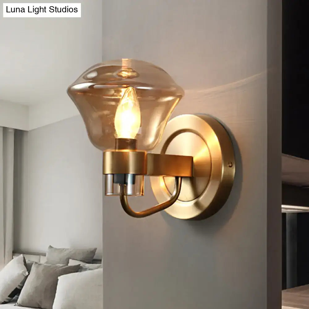 Gold-toned retro brass smoke gray amber glass light fixture with warm amber glass shade for bedroom sconce