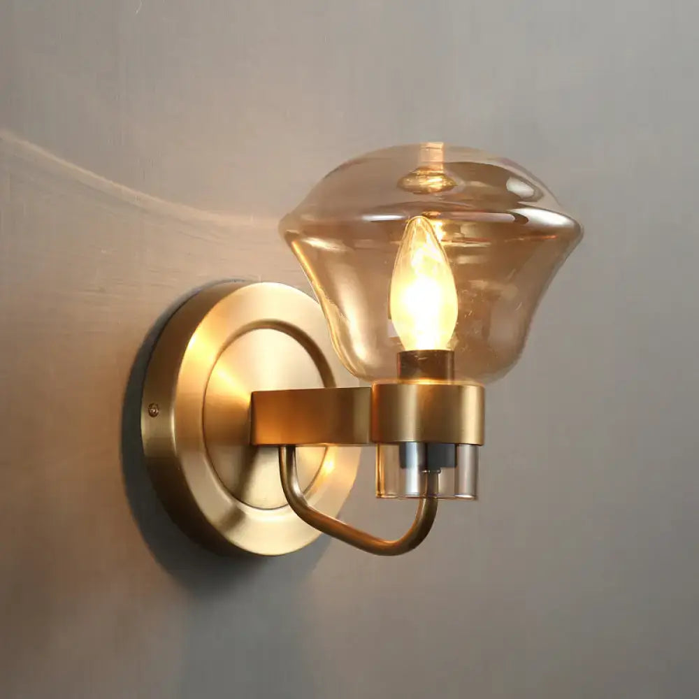 Brass-finished retro bedroom wall light fixture with smoke gray amber glass shade and exposed bulb sconce