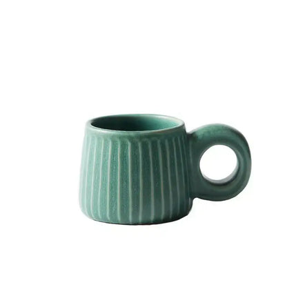 Teal handmade nordic ceramic mug with vertical ridges and circular ring handle for kitchen coffee decorbites use