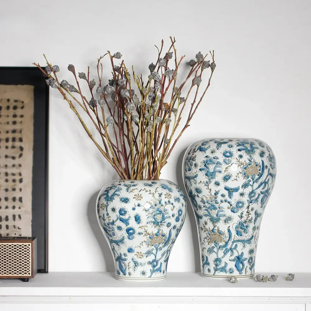 Two blue and white porcelain ceramic vases with intricate floral patterns perfect for living room decorbites blue set