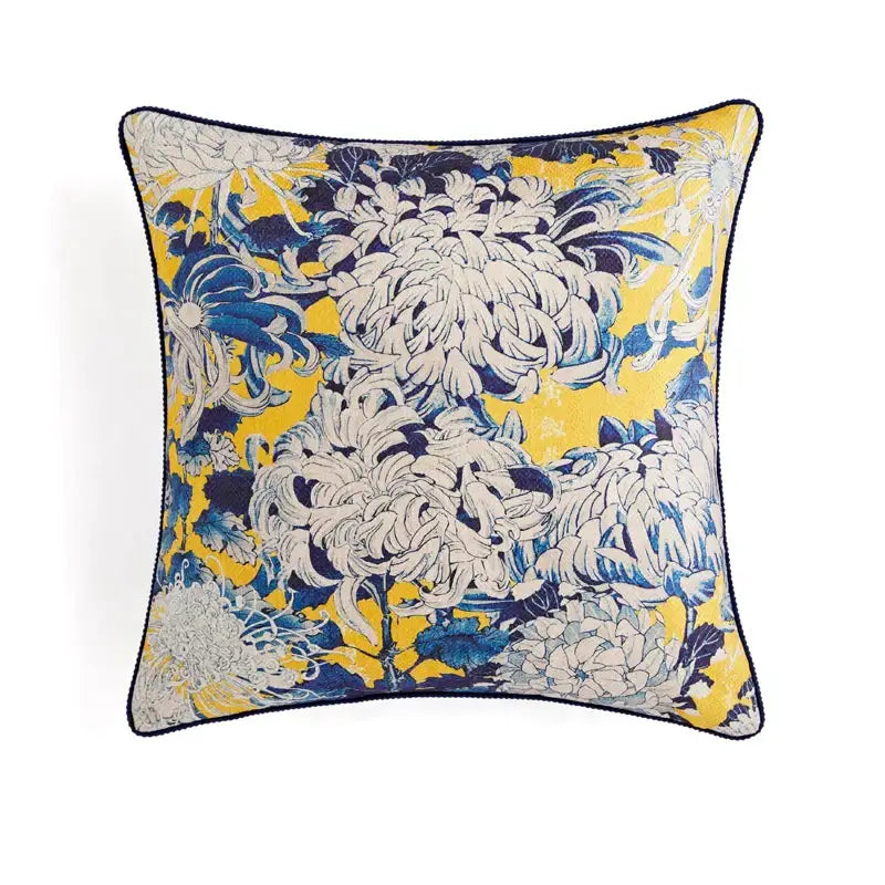Vibrant yellow retro circus pillow cover with navy blue floral pattern cream accents and matching dark trim decorbites circus retro