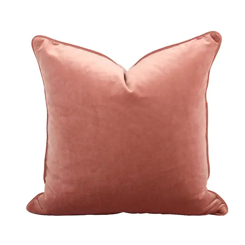A plush dusty rose velvet pillow cover with textured surface and tassels for decorbites circus retro living room decor