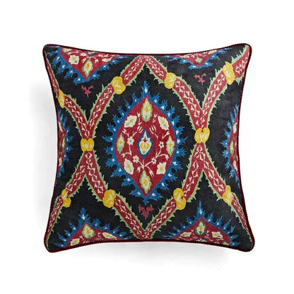 Square decorative pillow cover with intricate red blue yellow and green embroidery on dark background for decorbites circus retro decor