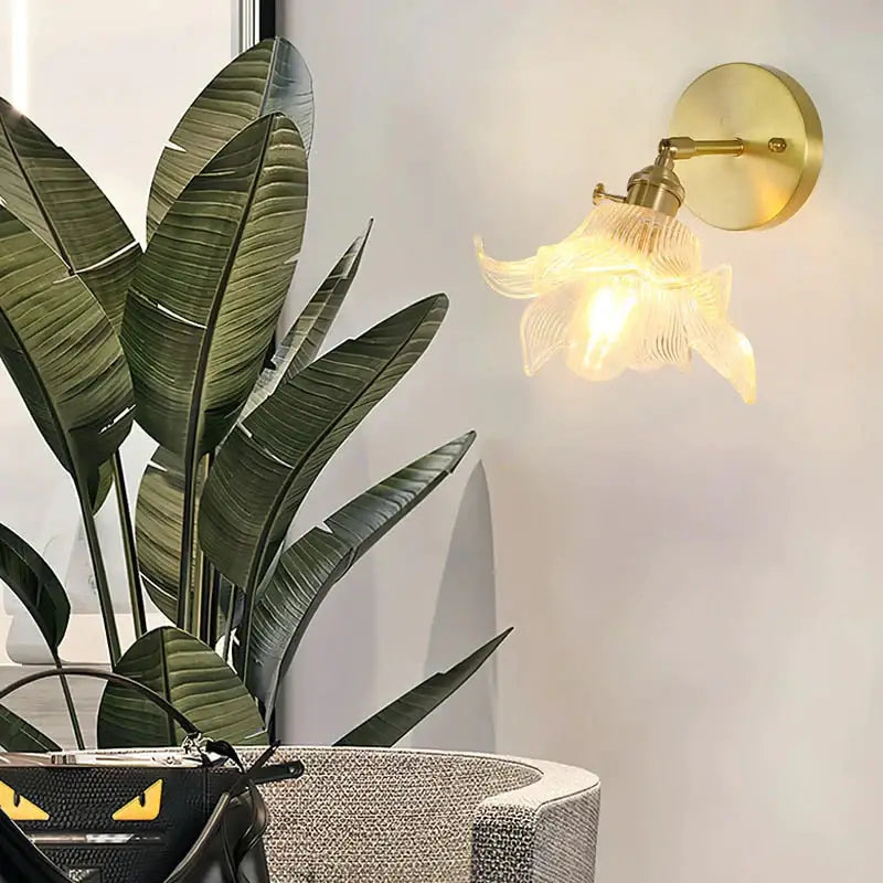 Gold-toned retro copper flower brass wall sconce with delicate translucent fluted glass shade for bedroom lighting