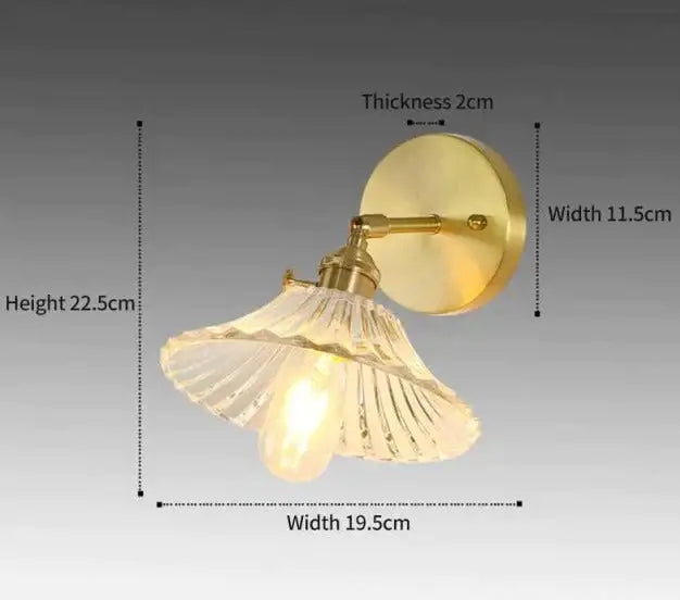 Retro copper flower brass wall sconce with gold-toned finish and clear fluted glass shade for bedroom lighting