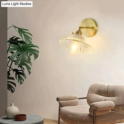 Gold-toned retro copper flower brass wall sconce with clear fluted glass shade for bedroom lighting