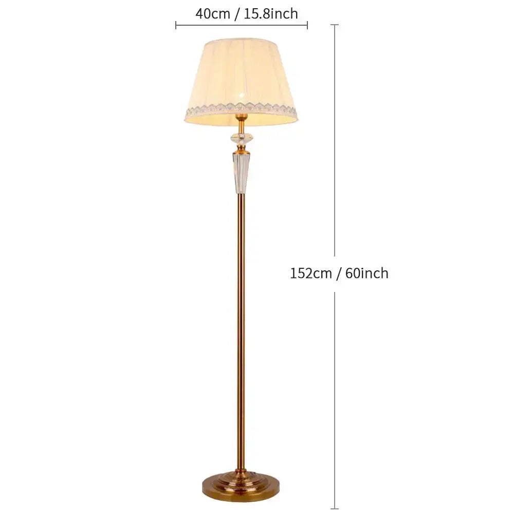 A tall, elegant brass crystal floor lamp with cream lace-trimmed shade for retro emerald green and gold decorbites decor