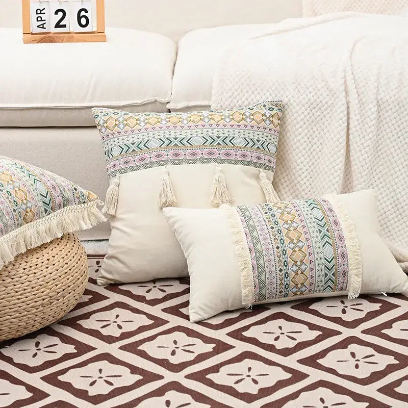 Cream-colored retro geometric cushion cover with muted green beige purple patterns and decorbites handmade tassel edges