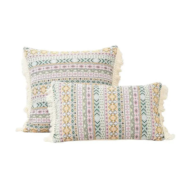 Two rectangular cushion covers with earthy geometric stripes and cream-colored decorbites handmade tassel edges for living room decor