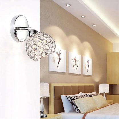 Chrome finished crystal wall sconce with a spherical globe design for retro gold and chrome living room decorbites crystal wall sconce