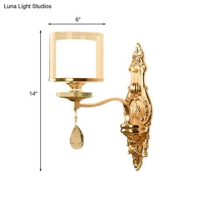 Retro gold wall mount lamp with ornate design frosted glass shade and dangling teardrop crystal accents for living room