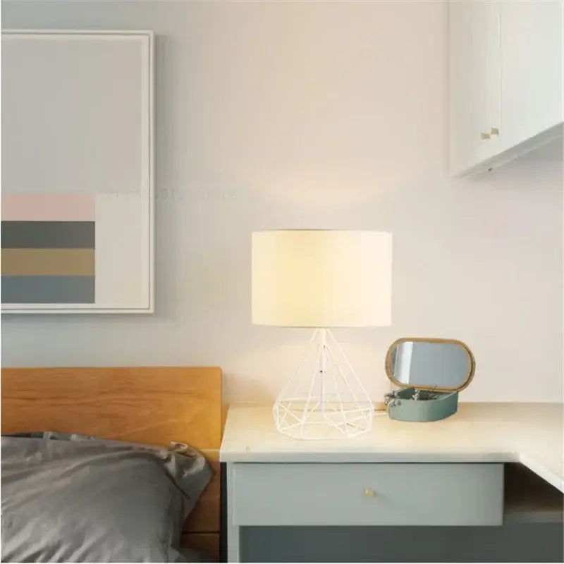 White geometric table lamp with wireframe base and cream fabric shade retro gold geometric table for study room