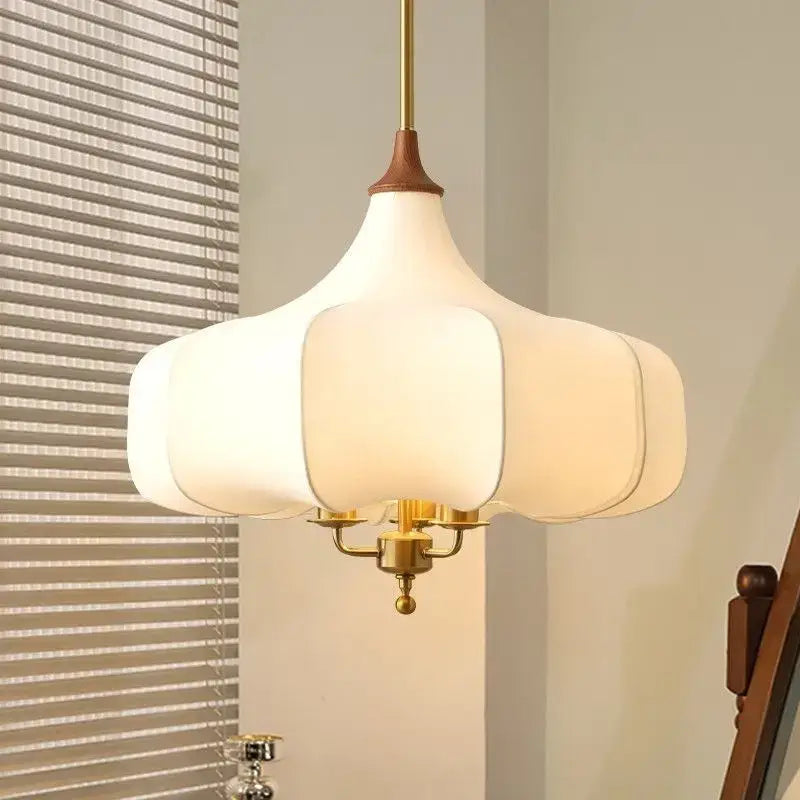 White petal-shaped pendant lights with brass-finished metal frame and wooden top for decorbites gold lustre retro decor