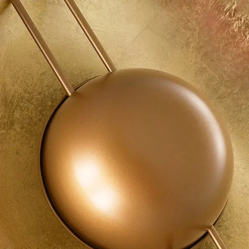 Retro gold round villa wall lamp featuring a matte gold spherical pendant with slender vertical rods for bedroom decorbites wall lamp