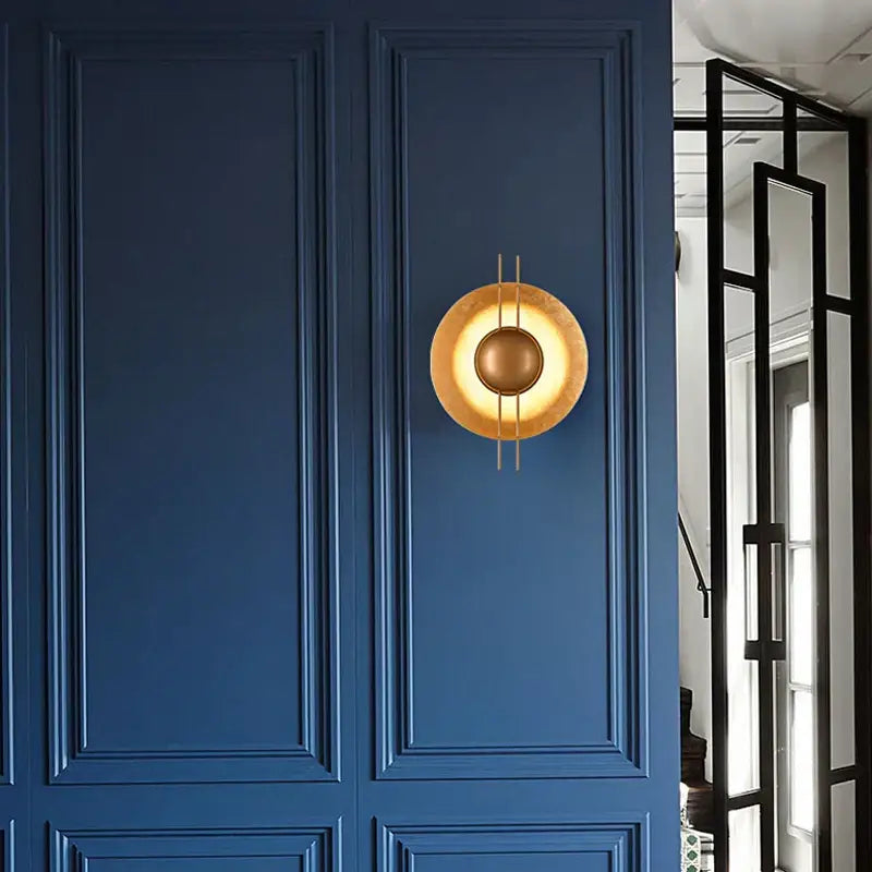 Retro gold round villa wall lamp with gold-toned circular design and vertical rods for elegant bedroom decorbites wall lamp