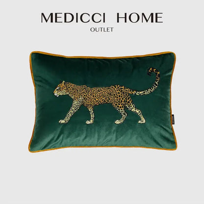 Emerald green velvet cushion cover with detailed embroidered leopard design and gold-trimmed edges for living room