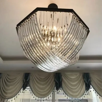 A modern retro hexagonal black metal e14 pendant light with cascading clear ribbed glass prisms for elegant decorbites decor
