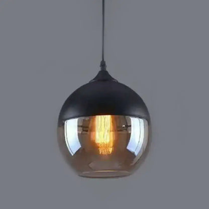 DecorBites 1 light pendant lighting with a spherical glass globe and metallic top in retro industrial style for restaurants