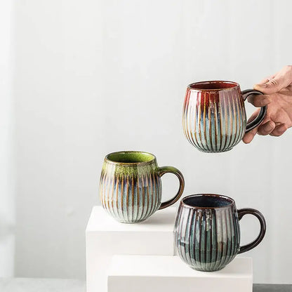 Handcrafted ceramic coffee mug with vertical ribbed texture and earthy gradient glaze perfect for kitchen use