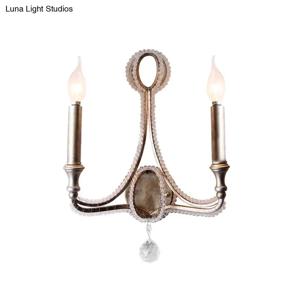 Antique brass two-light wall light with crystal accents and faceted pendant in retro loft fabric aged silver style
