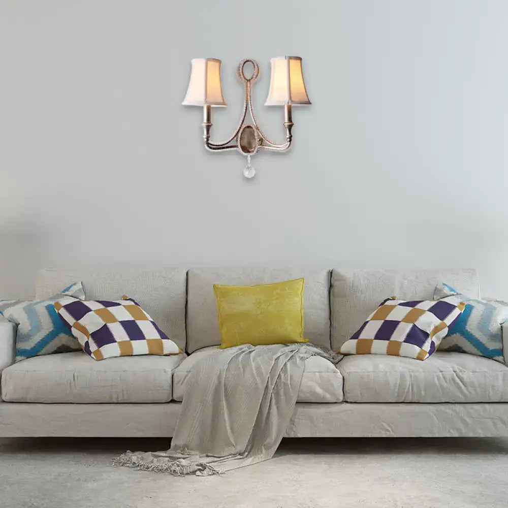 Brass two-light wall light with cream fabric shades and crystal accent for retro loft fabric aged silver bedroom decor