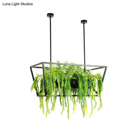 Black metal hanging planter with geometric frame and cascading foliage paired with decorbites™ retro metal ceiling light
