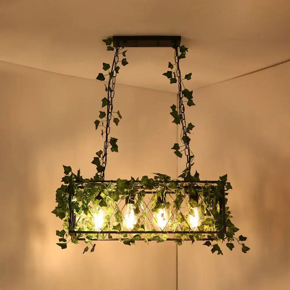 DecorBites™ black retro metal pendant light with rectangular frame, green ivy vines, and four glowing bulbs