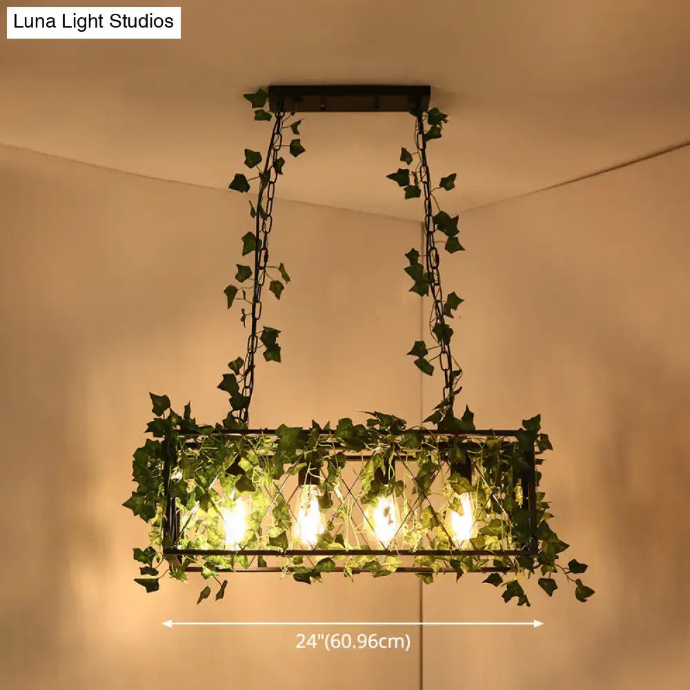 DecorBites™ black retro metal pendant light with rectangular frame, glowing filament bulbs, and hanging green ivy vines