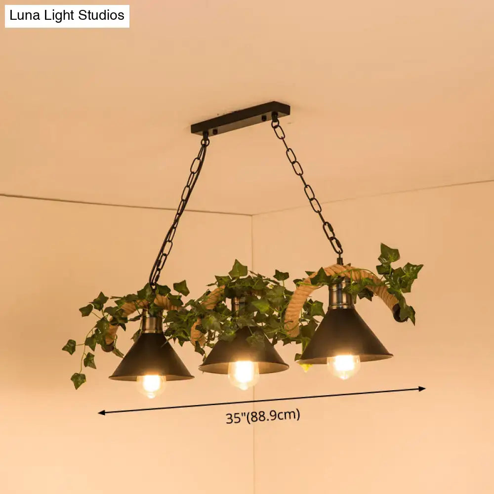 DecorBites™ black retro metal pendant light with three conical shades and green ivy on woven rope chains
