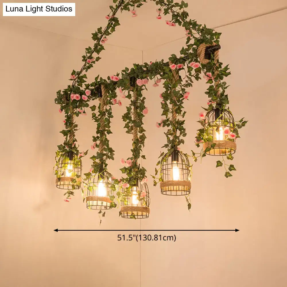 Decorbites™ black retro metal pendant light with five birdcage lights wrapped in ivy and pink flowers for industrial decor