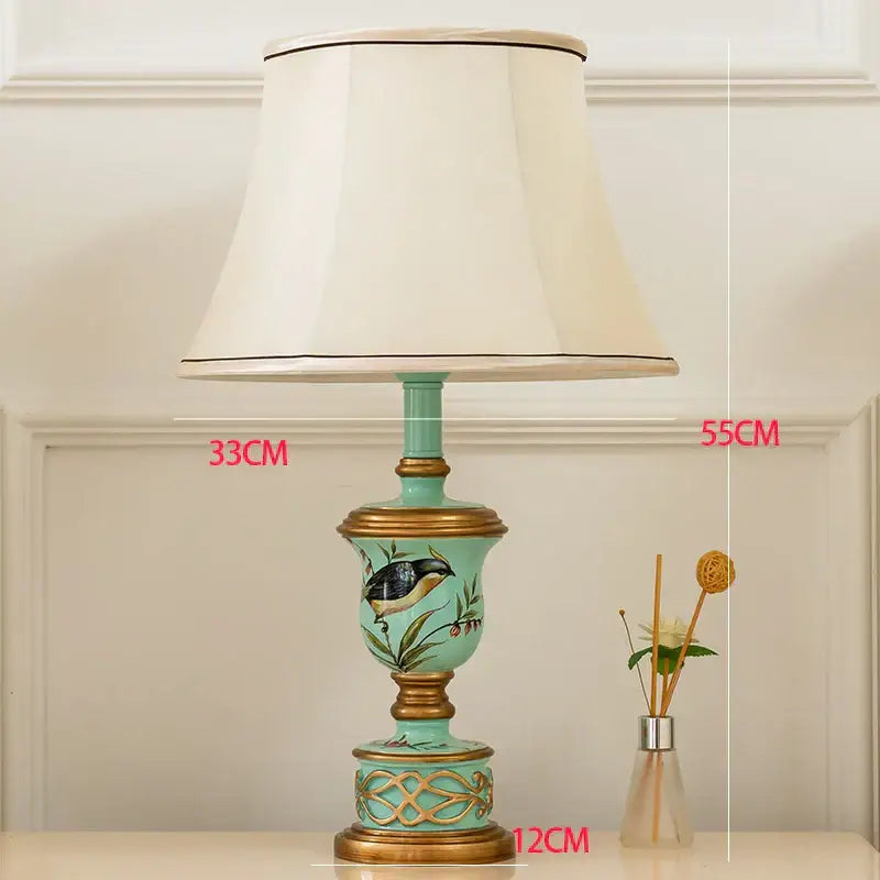Retro mint green resin table lamp with butterfly detail featuring turquoise ceramic and gold accents for bedroom decorbites green resin table