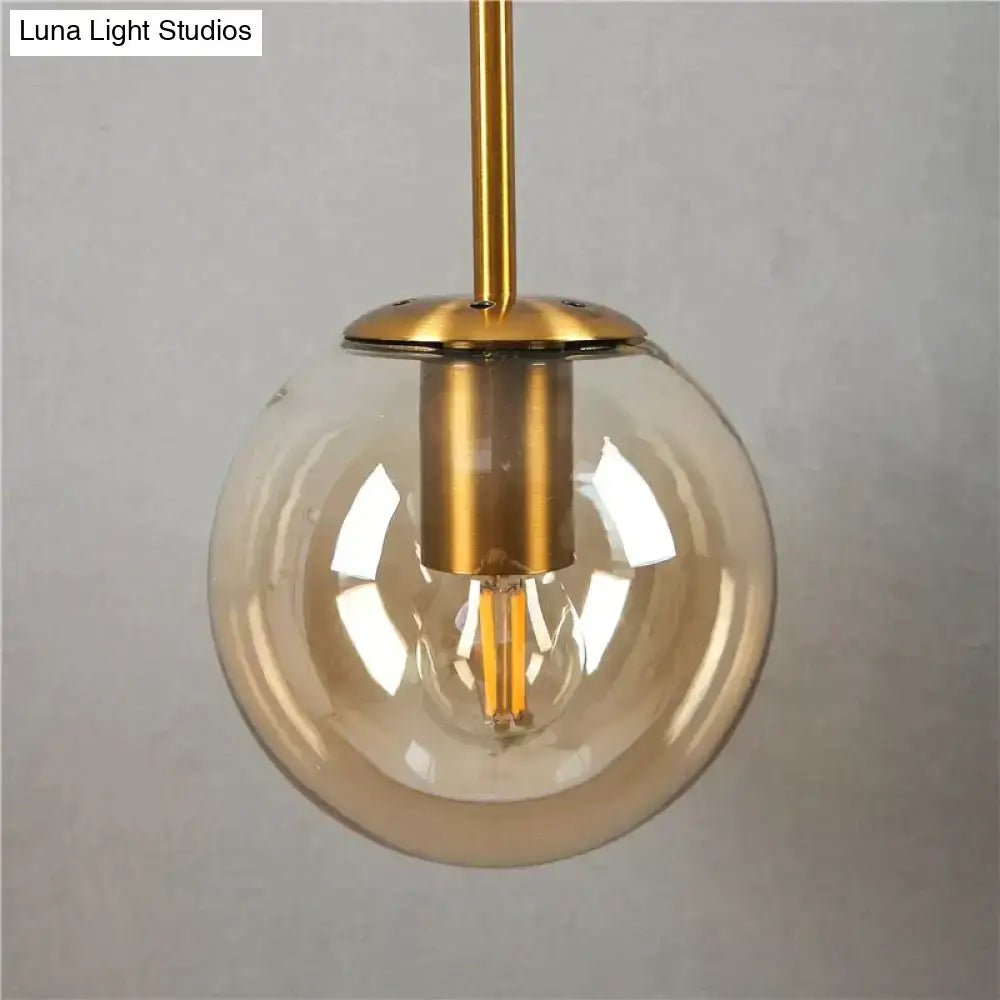 Retro modern glass smoked globe wall lamps with brass finish metal and spherical smoked glass for bedroom lighting