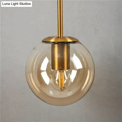 Retro modern glass smoked globe wall lamps with brass finish metal and spherical smoked glass for bedroom lighting