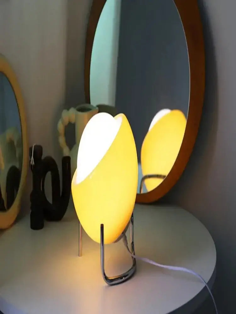 Retro orange decorbites glass table lamp with warm yellow egg-shaped shade and sleek chrome stand for bedroom use