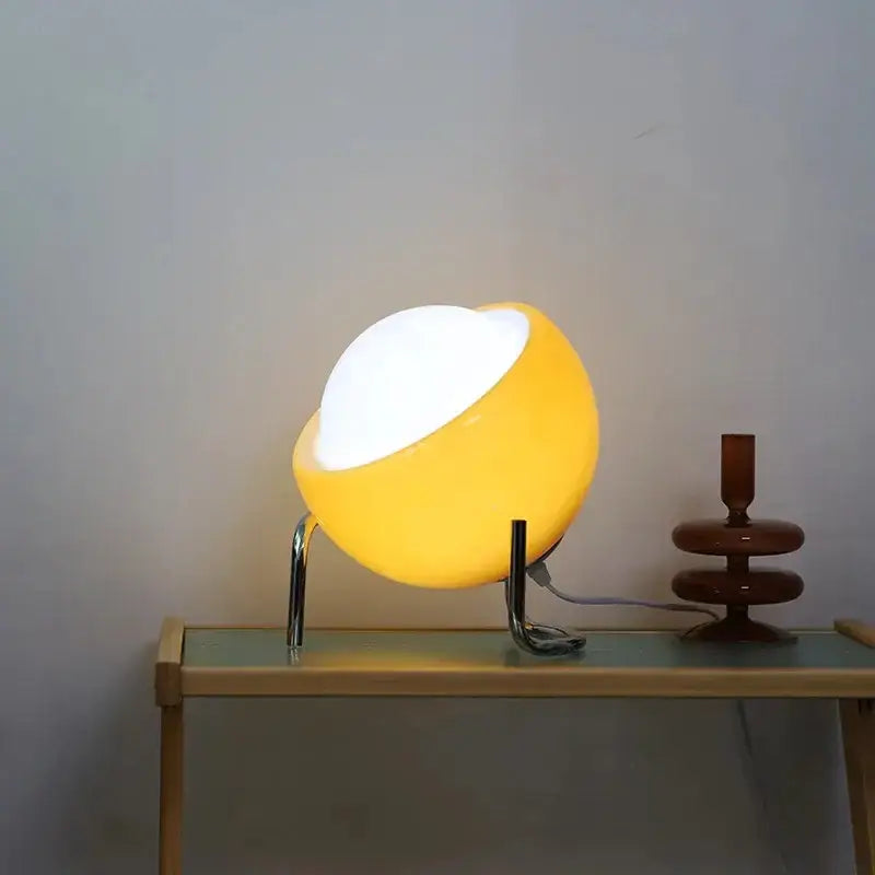 Retro orange glass table lamp with warm yellow half-sphere shade and chrome legs ideal as bedroom night light decorbites glass table