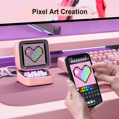 Retro pink pixel art game bluetooth speaker displaying a heart design on its ditoo pixel art grid screen