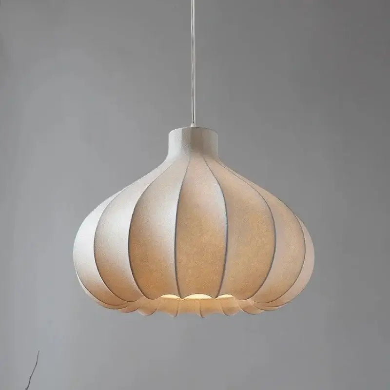 A warm-toned segmented paper decorbites led pendant light with soft diffused glow for home lighting decor