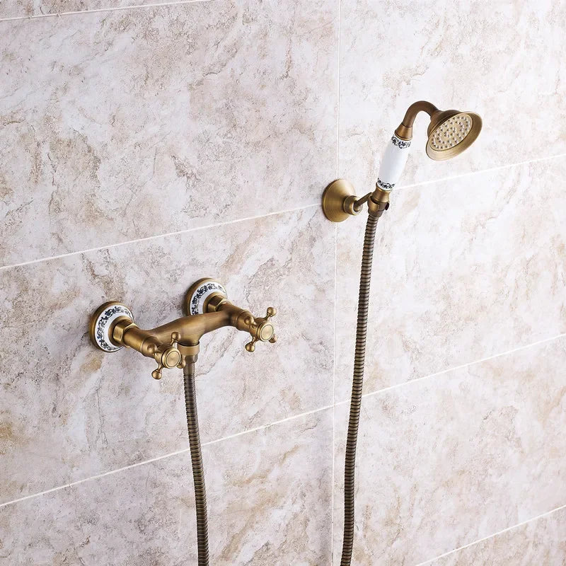 Antique brass retro shower faucet with double ceramic knob handles and white porcelain handheld showerhead accents