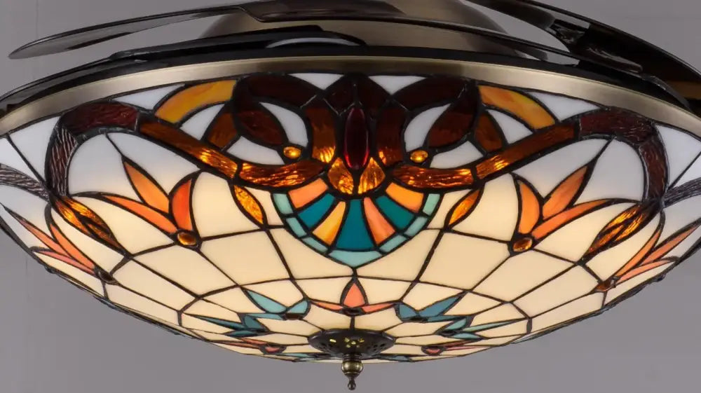 Decorative retro stained glass ceiling fan with remote control featuring amber teal and cream floral patterns in metallic frame
