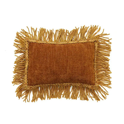A rectangular mustard-colored textured cushion cover with golden fringes for decorbites american luxe retro decor